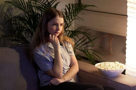 A Girl With A Bored Face Is Watching Tv Cozy Room Stock Image Image Of Cosiness Couch 188267479