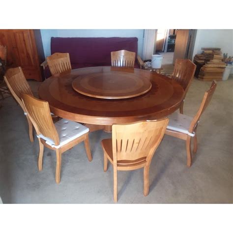 One (1) table with lazy susan materials: Round Dining Table With Lazy Susan and 7 Chairs Set | Chairish