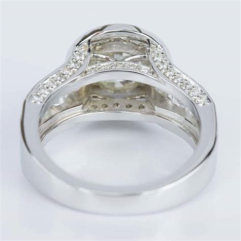 Bezel Set Halo Diamond Engagement Ring In White Gold