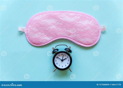 Sleeping Mask And Alarm Clock On Blue Background Stock Photo Image Of