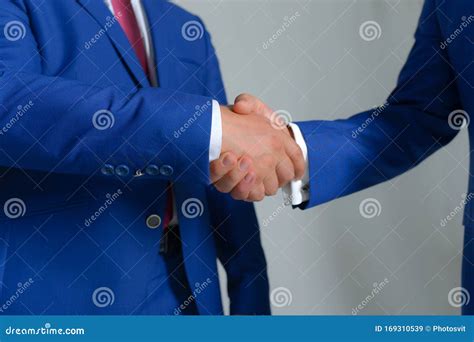 Men In Suits Or Businessmen Hold Hands Each Other Royalty Free Stock