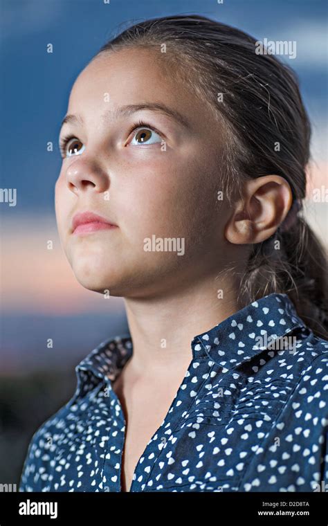 A Girl Looking Up Contemplatively Close Up Stock Photo Alamy