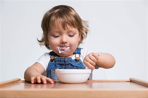 Baby Eat Yogurt Stock Photos Pictures And Royalty Free Images Istock