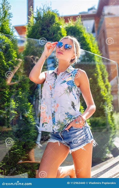 Slim Blond Woman In Jeans Shorts Posing Stock Photo Image Of Outdoor