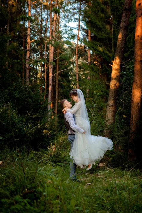 Premium Photo Beautiful Newlyweds Couple Walking In The Forest