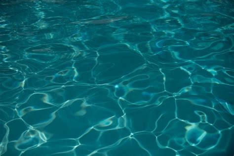 Premium Photo Background Of Blue Water In Swimming Pool With Sun