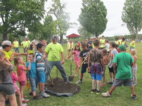 Treat them like babies, with extra tlc. Children At Summer Playground Program Plant Trees At Allen ...