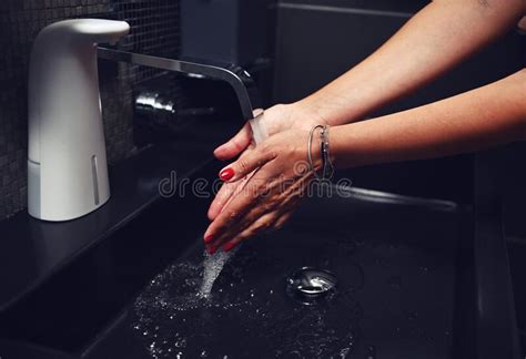 Close Up Of Female Well Groomed Hands A Woman Washes Her Hands Thoroughly Under Running Water