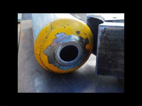 It's easiest if you cut three sides of the square and leave the upper line alone. Rocket Stove made from fire extinguisher and 4 in square tube Part 1 - YouTube