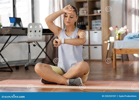 Tired Teenage Girl With Gadgets Exercising At Home Stock Image Image