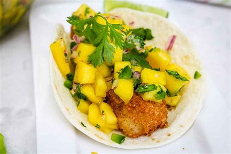 How to make delicious mango and tomato salsa to your liking. Cod Fish Tacos with Spicy Mango Salsa - Grumpy's Honeybunch