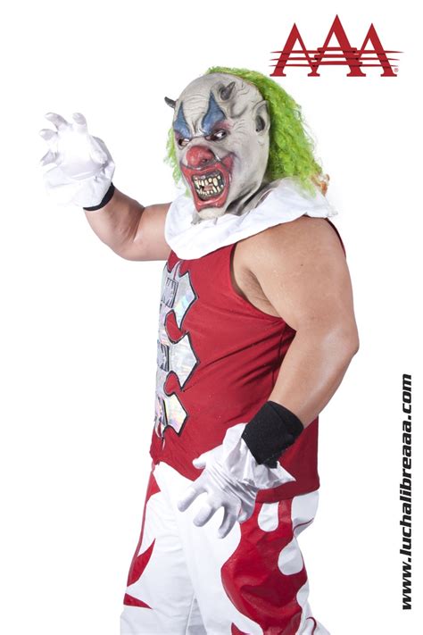 A Man In Clown Makeup And Green Hair Is Wearing A Red Shirt With White