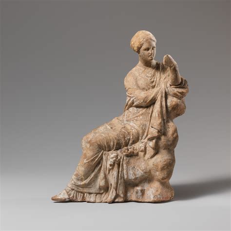 Terracotta Statuette Of A Woman Seated On A Rock Greek South Italian