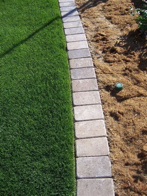 This montecito front yard was transformed with artificial turf, boulder edging, planting, landscape lighting and more. Garden Edging Ideas - Transform your Garden Today