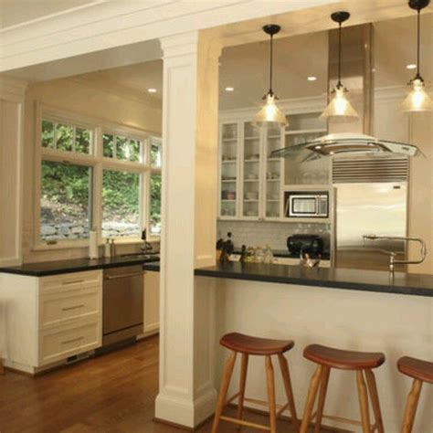 Kitchen island with support post ideas. The structural beam and support column were integrated ...