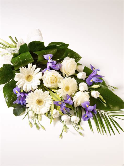 Funeral flowers and sympathy flowers are an important way that we convey condolences and enhance a solemn funeral service. Classic Sheaf - Funeral Flowers