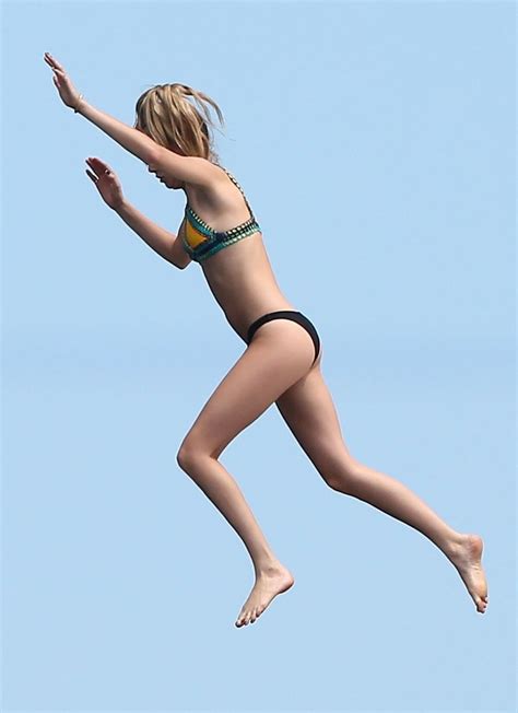 Glossy Photo Picture 8x10 Cara Delevingne In The Air In A Bikini Ebay