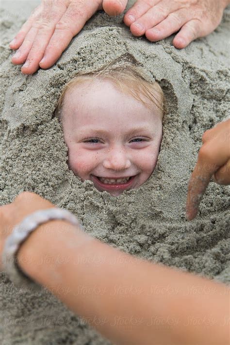 Child Buried In Sand At Beach By Raymond Forbes Llc Beach Photoshoot