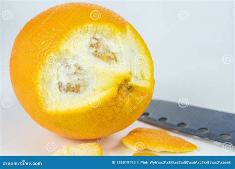 Peeled Orange With Very Thick Skin On A White Kitchen Table Cit Stock