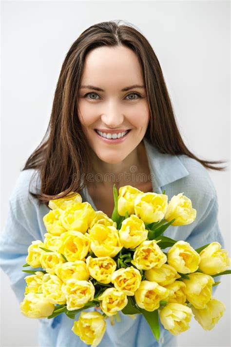 Vertical Portrait Of Caucasian Smiling Brunette Woman With Yellow