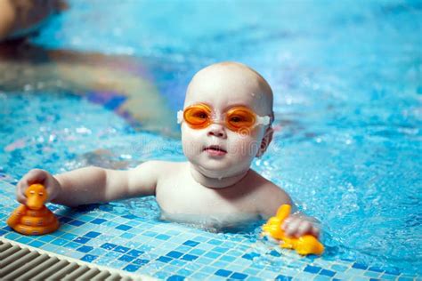 Child Swims In The Pool Little Boy Learns To Swim In The Pool Stock