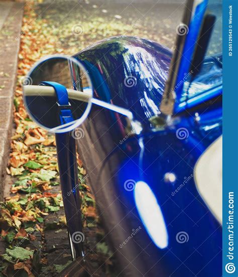 Vertical Shot Of A Blue Old Classic Car With Round Mirror Stock Image