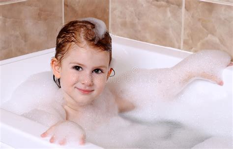 You can add some aromatherapy oils to your bathwater to help you relax and relieve some of the edginess of your emotional state. Little Girl Is Taking A Bath Stock Image - Image of ...