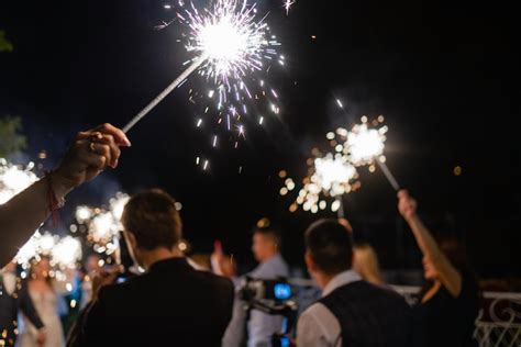 Premium Photo Group Of Friends Enjoying Out With Sparklers Young Men