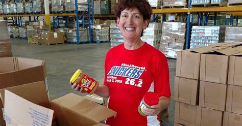Local volunteers help load cars as they drive through. I Volunteered At 200 Food Banks Across The U.S. Here's ...