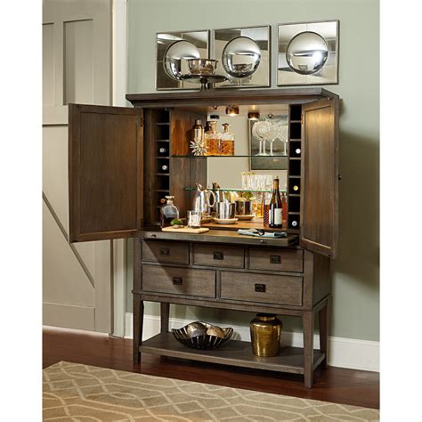 Luxury bar cabinets featuring glamorous glass shelves and back mirrors, exclusively crafted for connoisseurs. TABLE TRENDS Park Studio Contemporary Bar Cabinet with ...