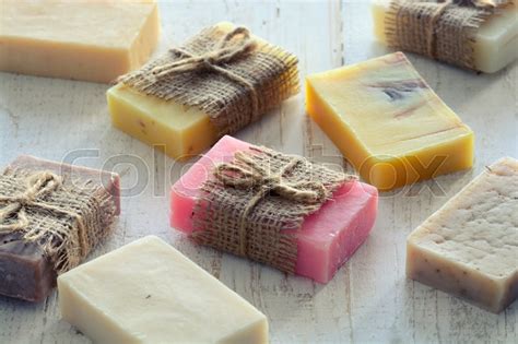 Handmade soap manufacturers and suppliers. Collection of handmade soap on wooden background | Stock ...