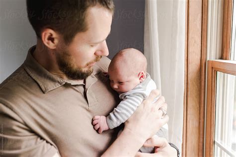 Dad Holding Newborn Baby Boy By Stocksy Contributor Lea Jones Stocksy