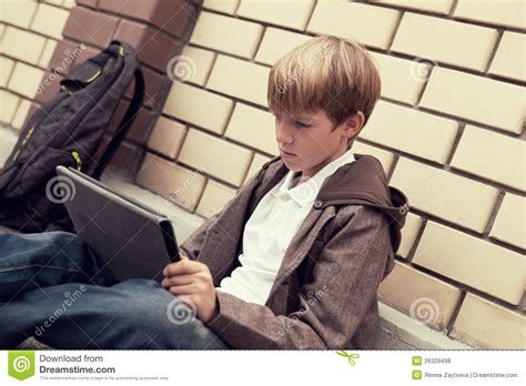 School Teen With Electronic Tablet Sitting Royalty Free