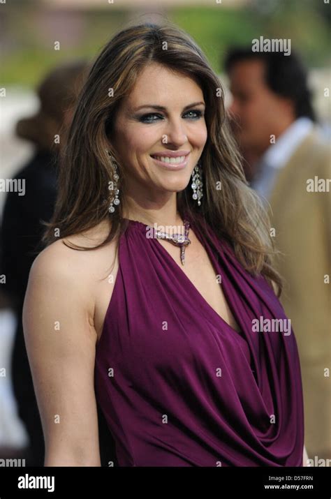 British Actress And Model Liz Hurley Attends A Fashion Show By Amber
