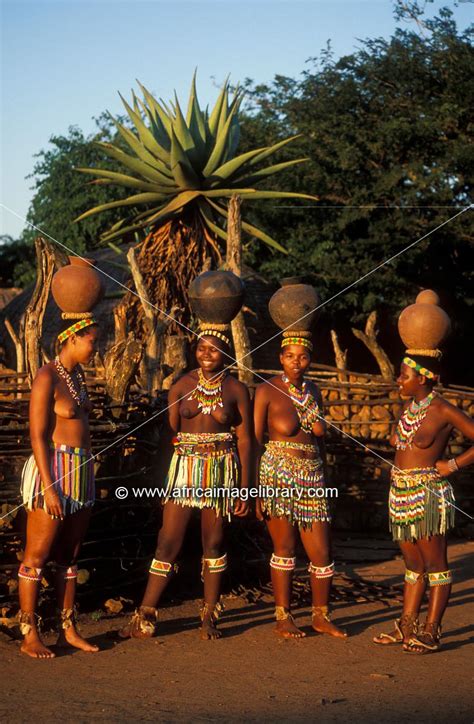 Photos And Pictures Of Zulu Girls Carrying Clay Pots With Water Shakaland Kwazulu Natal