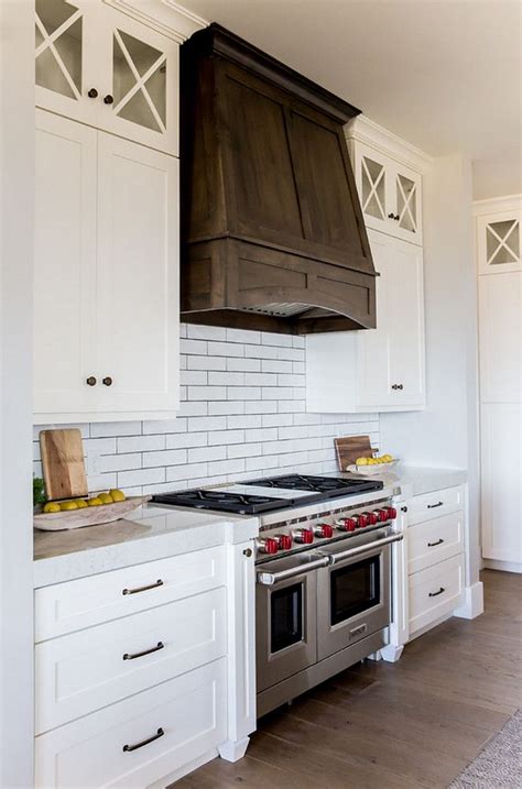 With so many styles and shades of dark kitchen cabinets to choose from, it can be confusing knowing what to go for. White kitchen with dark walnut hood. White kitchen with dark stained walnut hood and X Mullion ...