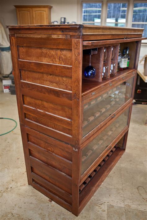 Put smooth side down of the plexi glass on the backside of the sands cabinet doors. Repurposed Lawyers Bookcase Wine and Liquor Cabinet by ...