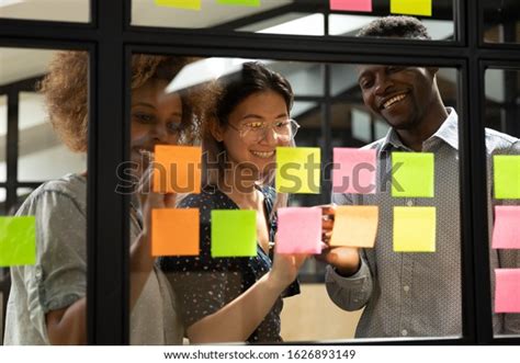 Smiling Diverse Multiracial Work Group Busy Stock Photo Edit Now