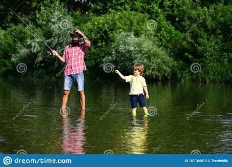 Father And Son Fishing Father With His Son On The River Enjoying