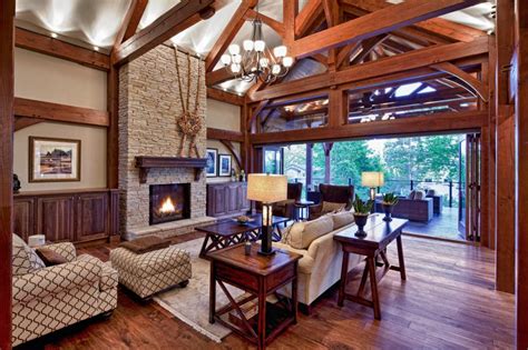 Inviting Traditional Living Room With Intricate Ceiling Beams And Tall Stone Fireplace Hgtv