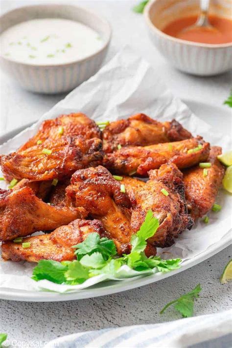 Air fryer chicken wings are so crispy without any added oil! Air Fryer Sweet and Spicy Chicken Wings | CopyKat Recipes
