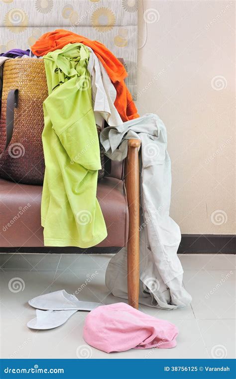 Messy Clothes Scattered On A Leather Sofa Stock Image Image Of Living