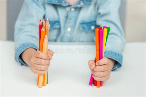 A Child Holds A Felt Pens And Pencils School Concept Stock Image