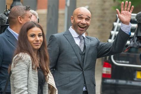 arrogant goldie grins as he leaves court after being found guilty of lashing out when he was
