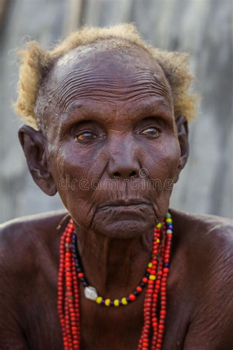 Dassanech Tribe Old Woman With Traditional Bright Necklace In The Local