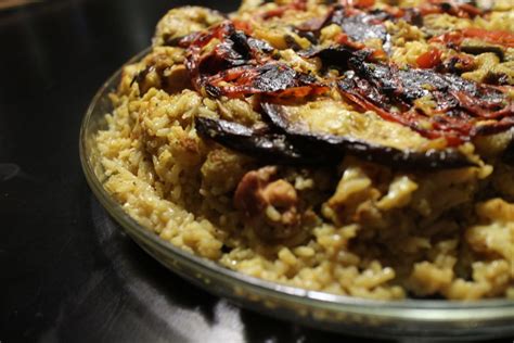 Rice is cooked with cardamom and orange food color, then combined with sugar, raisins, walnuts, almonds, orange zest and cream in this warm pakistani . RECIPE: Maklubah, Arabic upside-down chicken and rice meal ...
