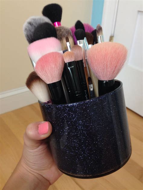 This classy leather stencil brush holder is a lovely way to store and carry your prized collection. DIY glitter brush holder made out of bath and body works ...