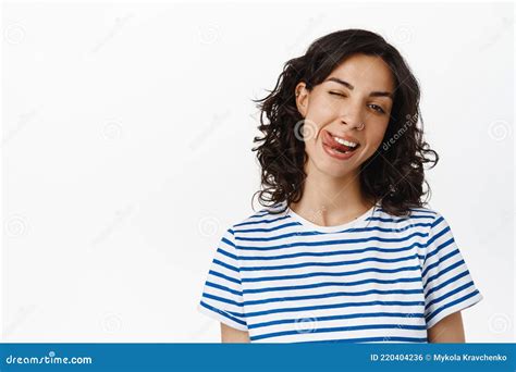 Emotions And People Concept Happy Brunette Girl Showing Tongue Winking And Smiling Happy