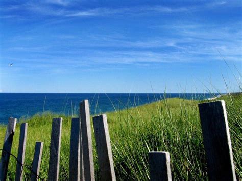A Wooden Fence In Front Of The Ocean