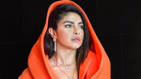 priyanka chopra wore a riveting orange blazer dress to launch bulgari s jannah collection